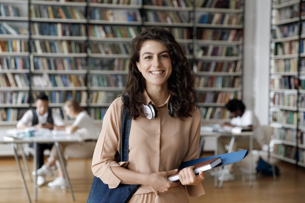 Happy,Hispanic,Gen,Z,Student,Girl,With,Headphones,Visiting,Public