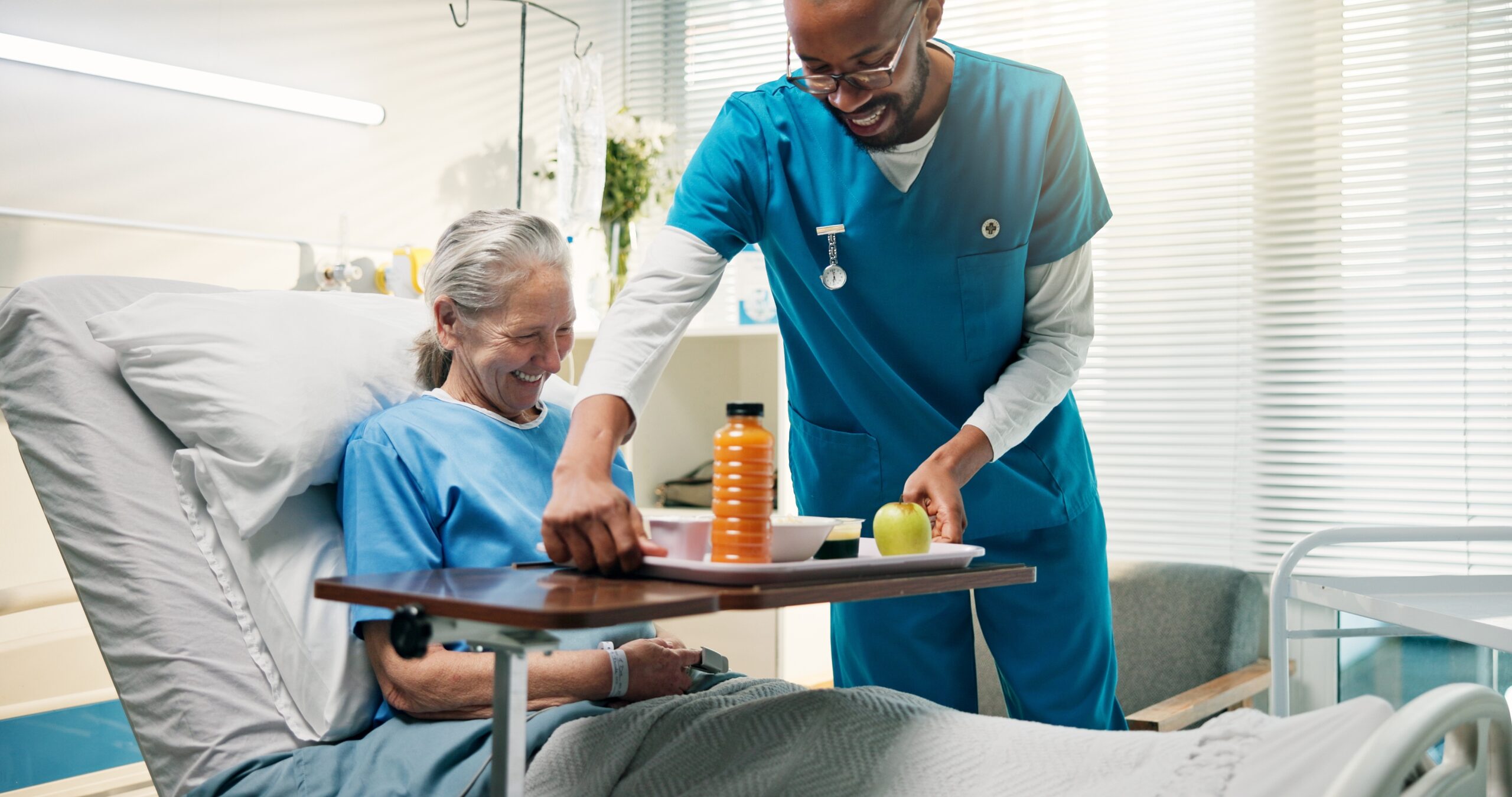 Senior,Woman,,Smile,And,Nurse,With,Food,In,Hospital,Bed